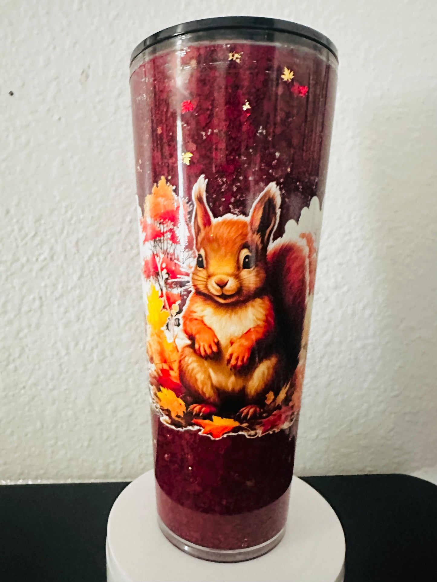24oz autumn squirrel with red and orange leaves